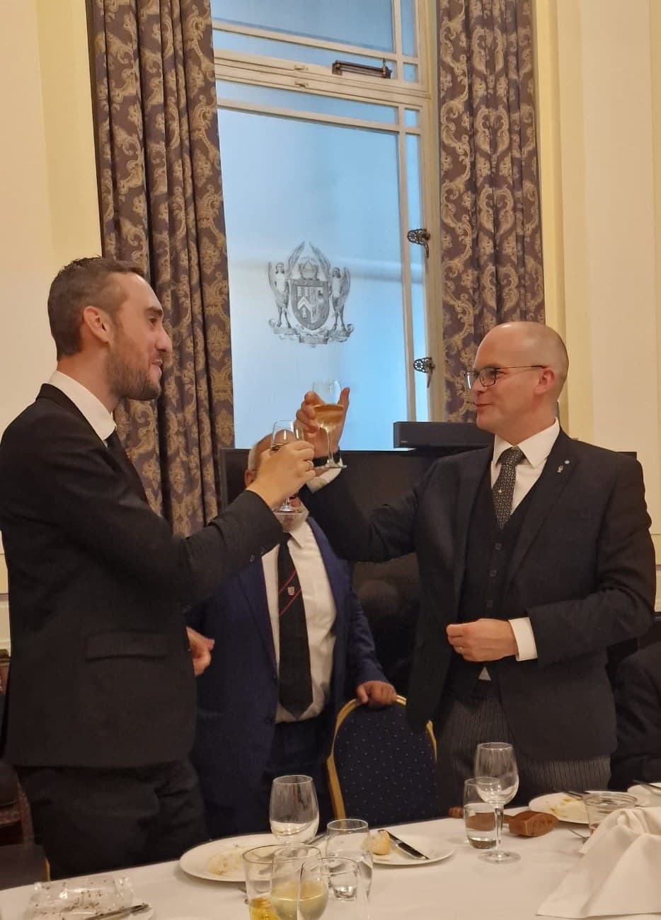 Bro. Gael raising a toast at the festive board after his initiation